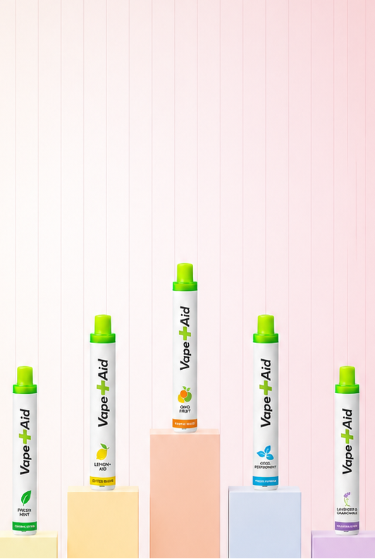 Vape+Aid products on geometric blocks on a pastel background