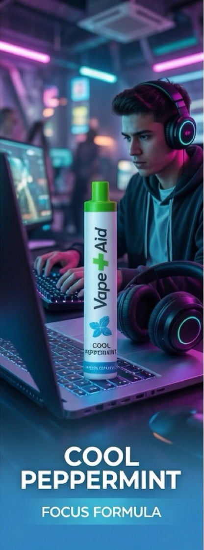 Man wearing headphones works on laptop in neon-lit room with Vape+Aid Cool Peppermint Focus Formula diffuser in foreground.