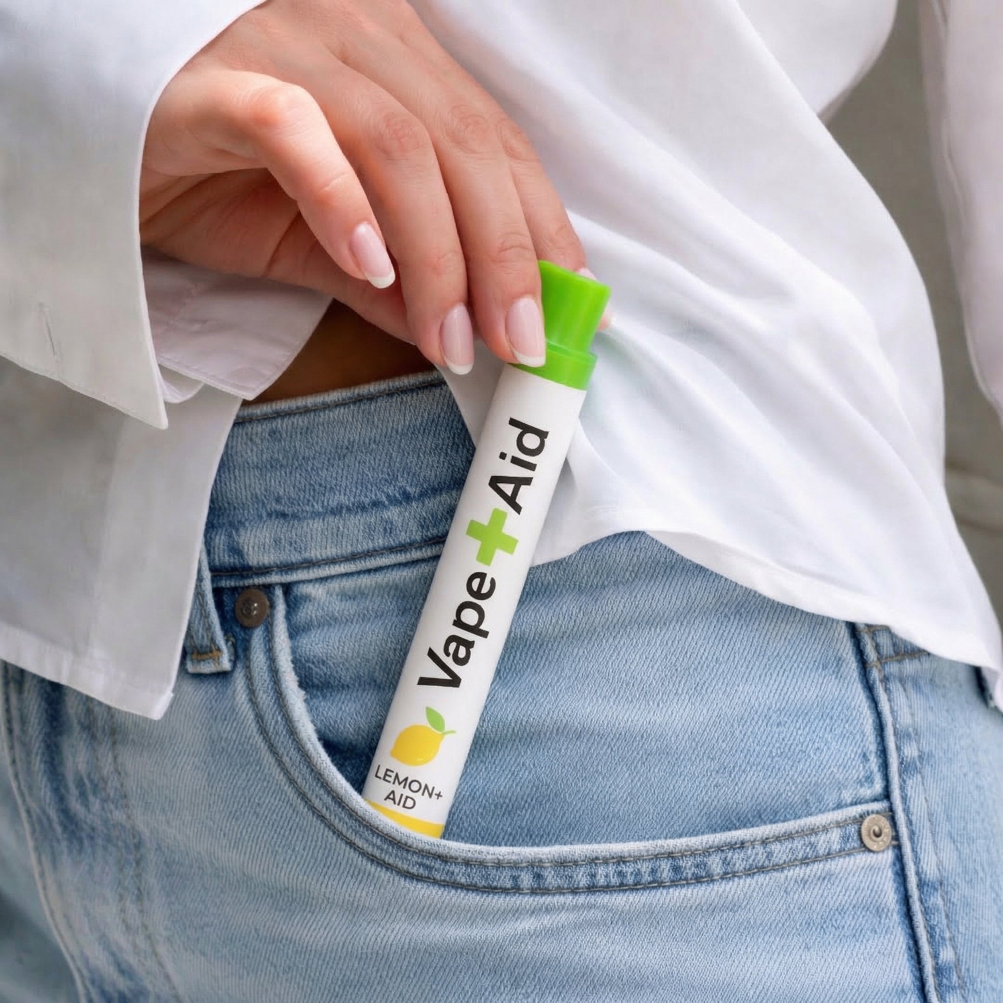 Hand taking out a Vape+Aid diffuser from their jeans pocket